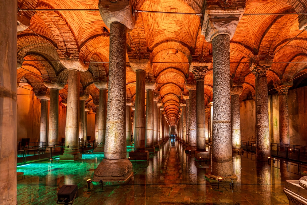 Basilica Cistern interior with illuminated columns and water reflections in Istanbul