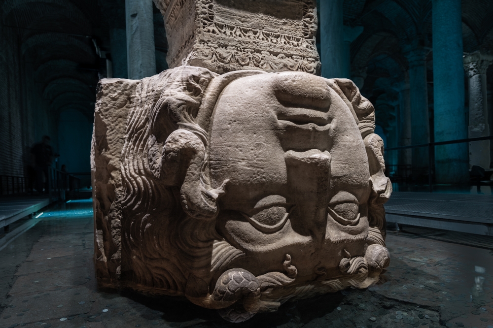 Medusa head at the base of a column in the Basilica Cistern