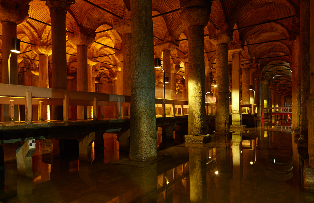 Wooden walking platforms above water inside the Basilica Cistern in Istanbul